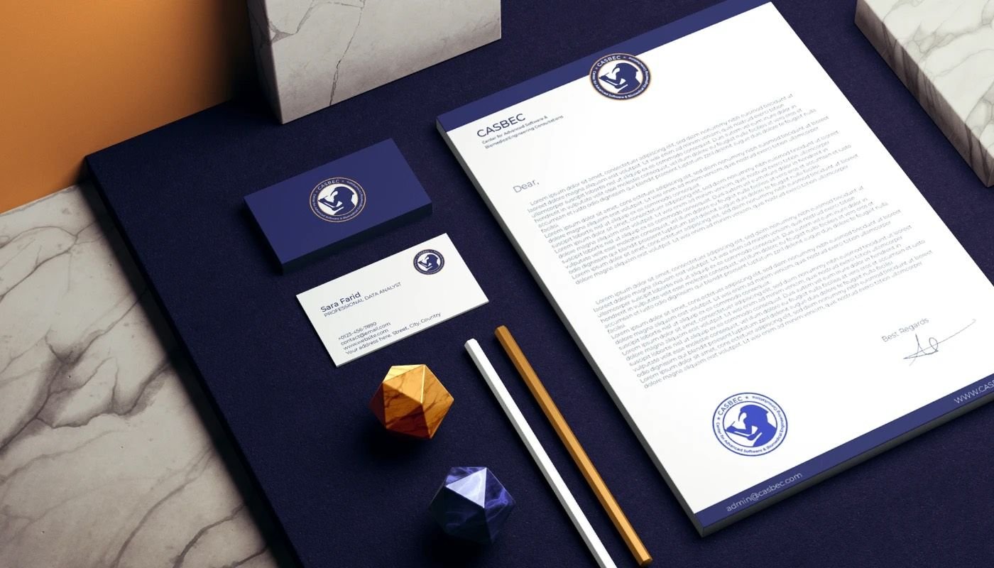 CASBEC business cards in navy with the gold emblem
