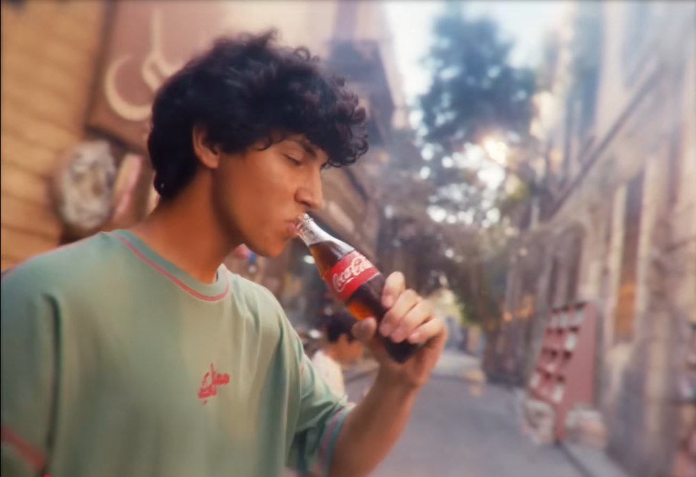 Final film frame — the first sip on the street