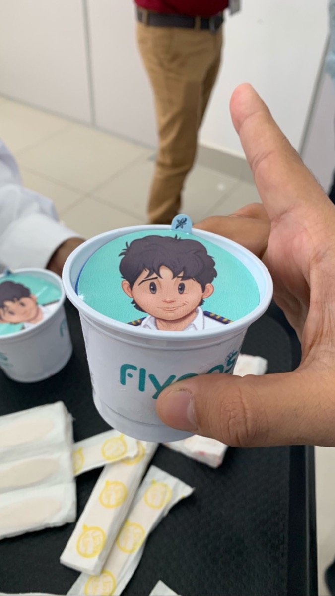 flynas branded cups with Captain Firnas