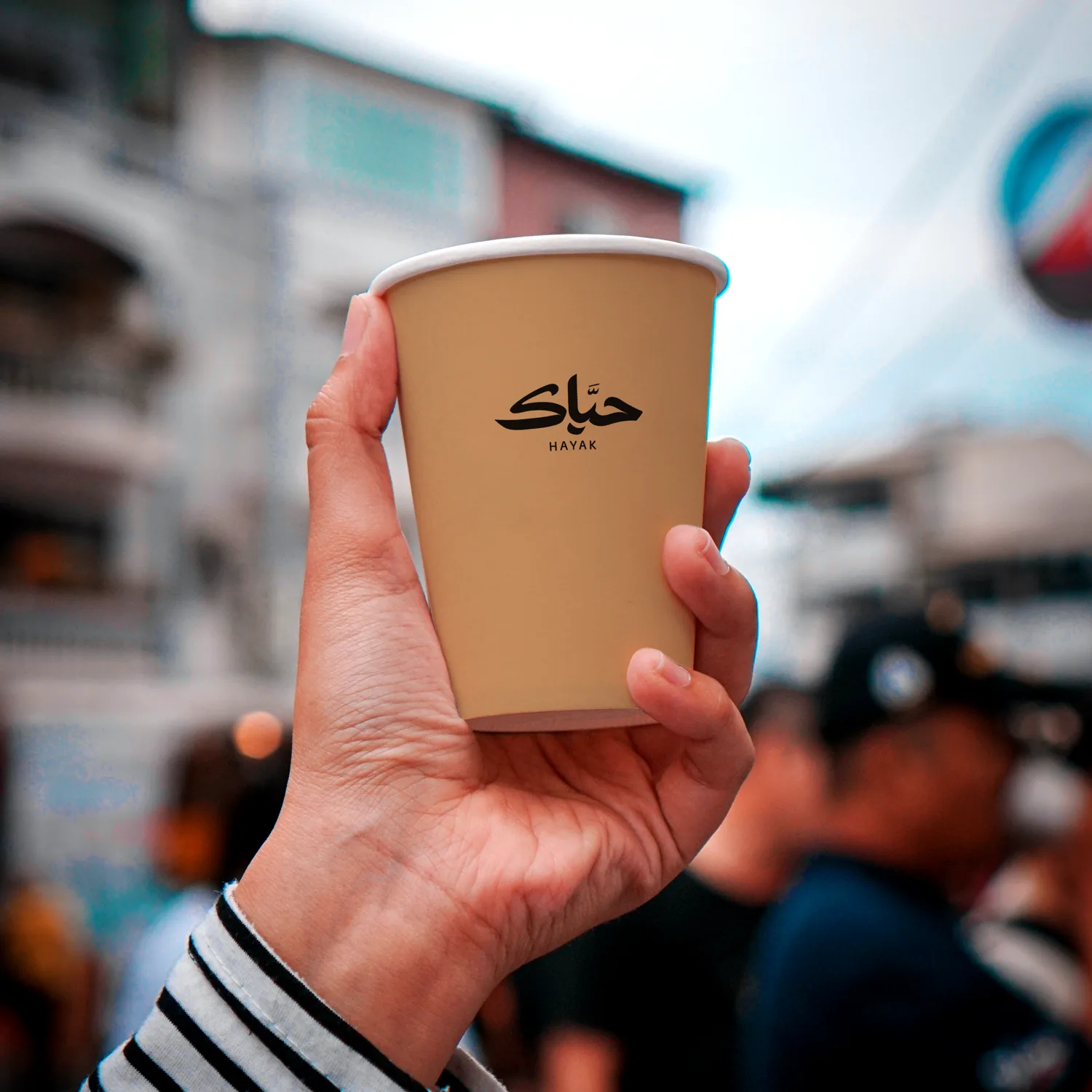 A Hayak cup held on the street
