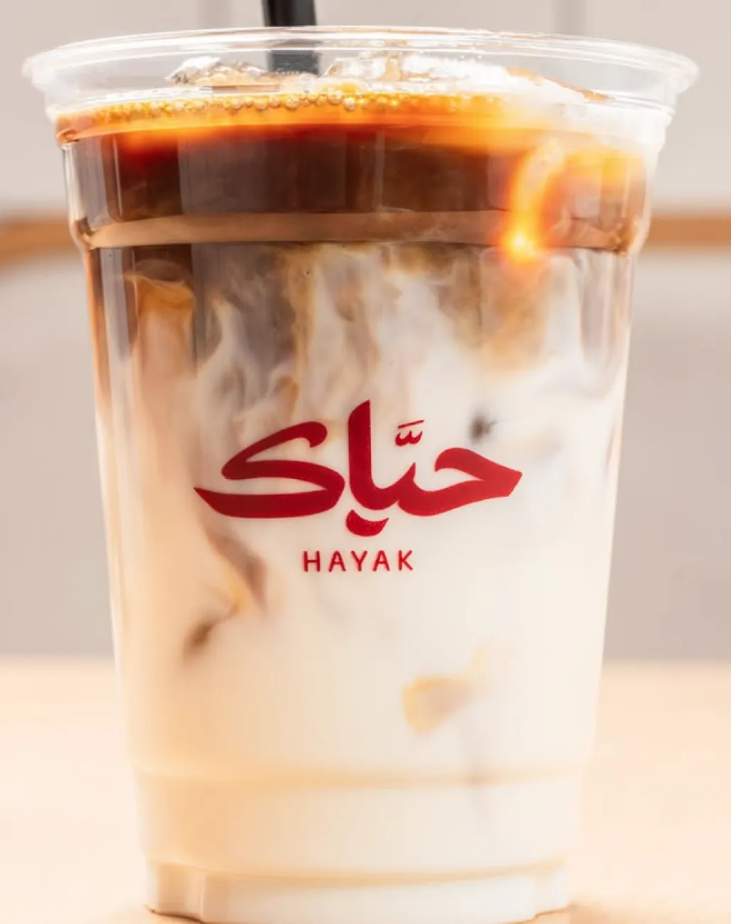 Hayak iced coffee in a branded cup