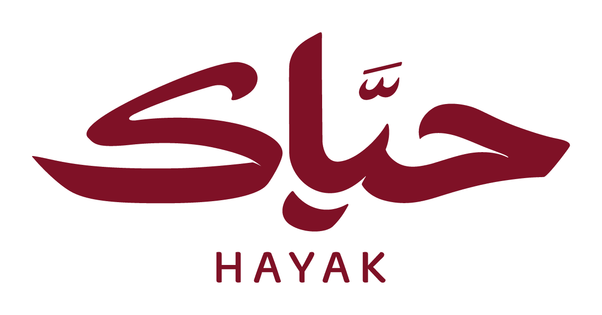The Hayak calligraphic wordmark in wine-red on cream