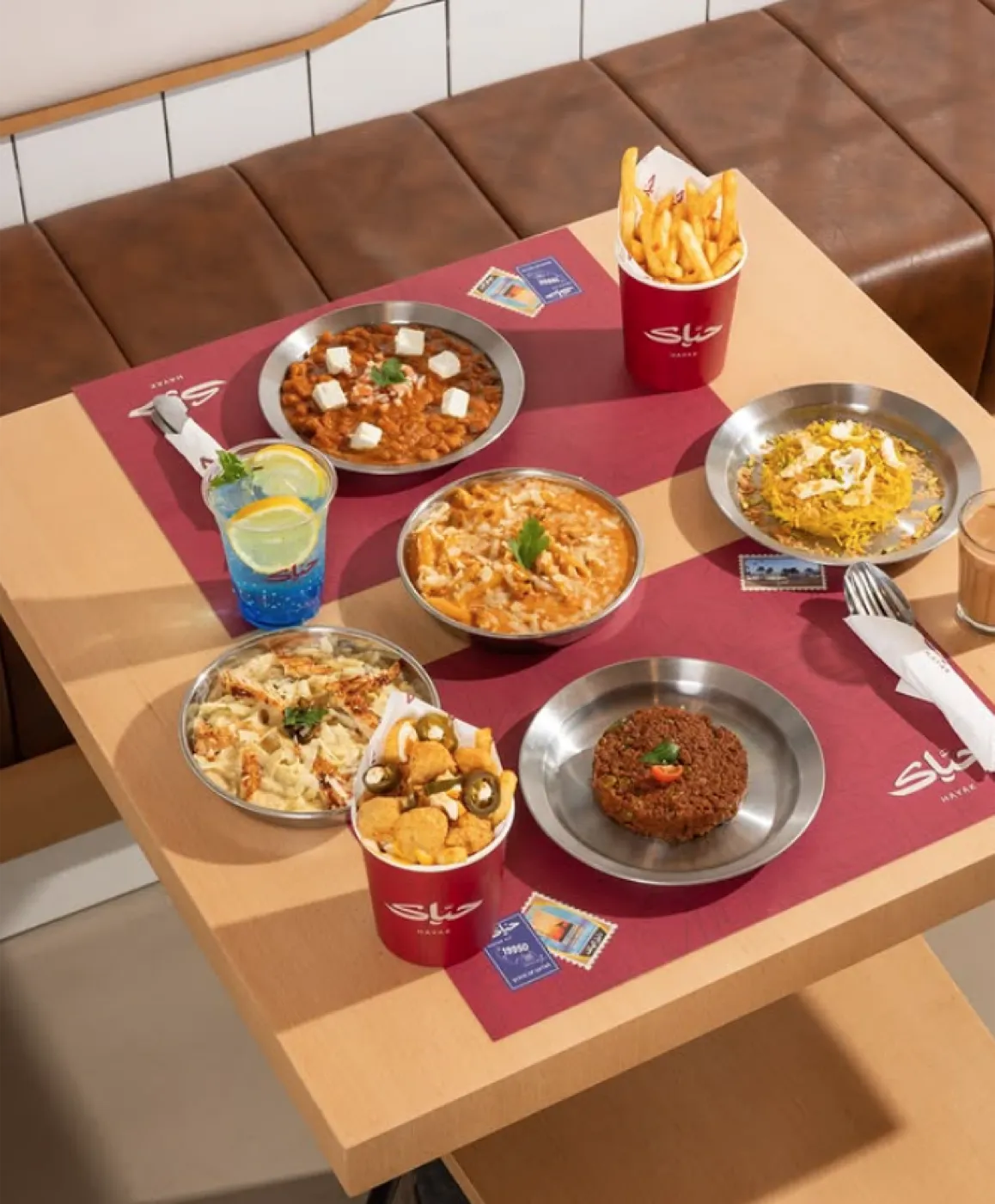 A full Hayak table spread of food and drinks