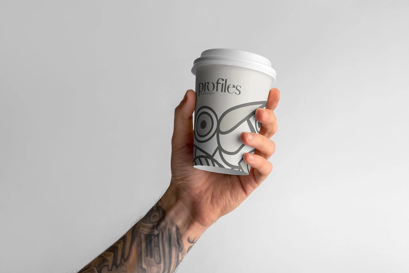 profiles by Roastado takeaway cup in hand