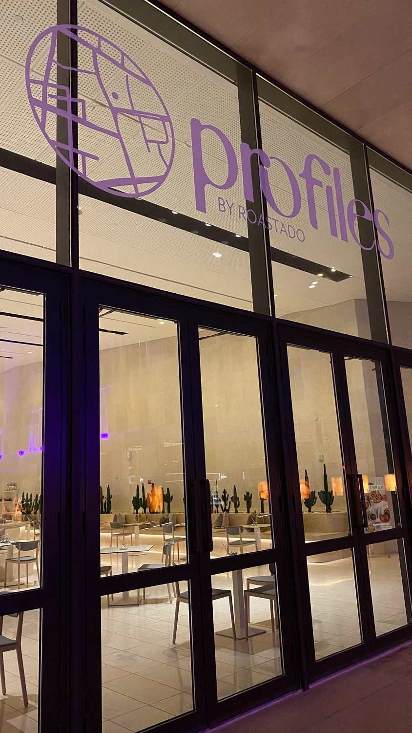 profiles by Roastado signage etched on glass
