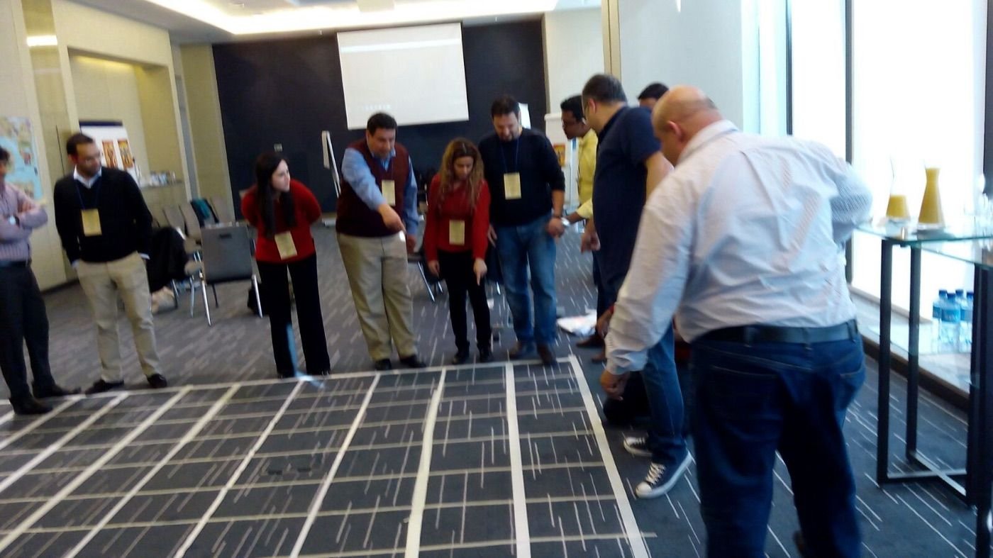 Players around a floor board