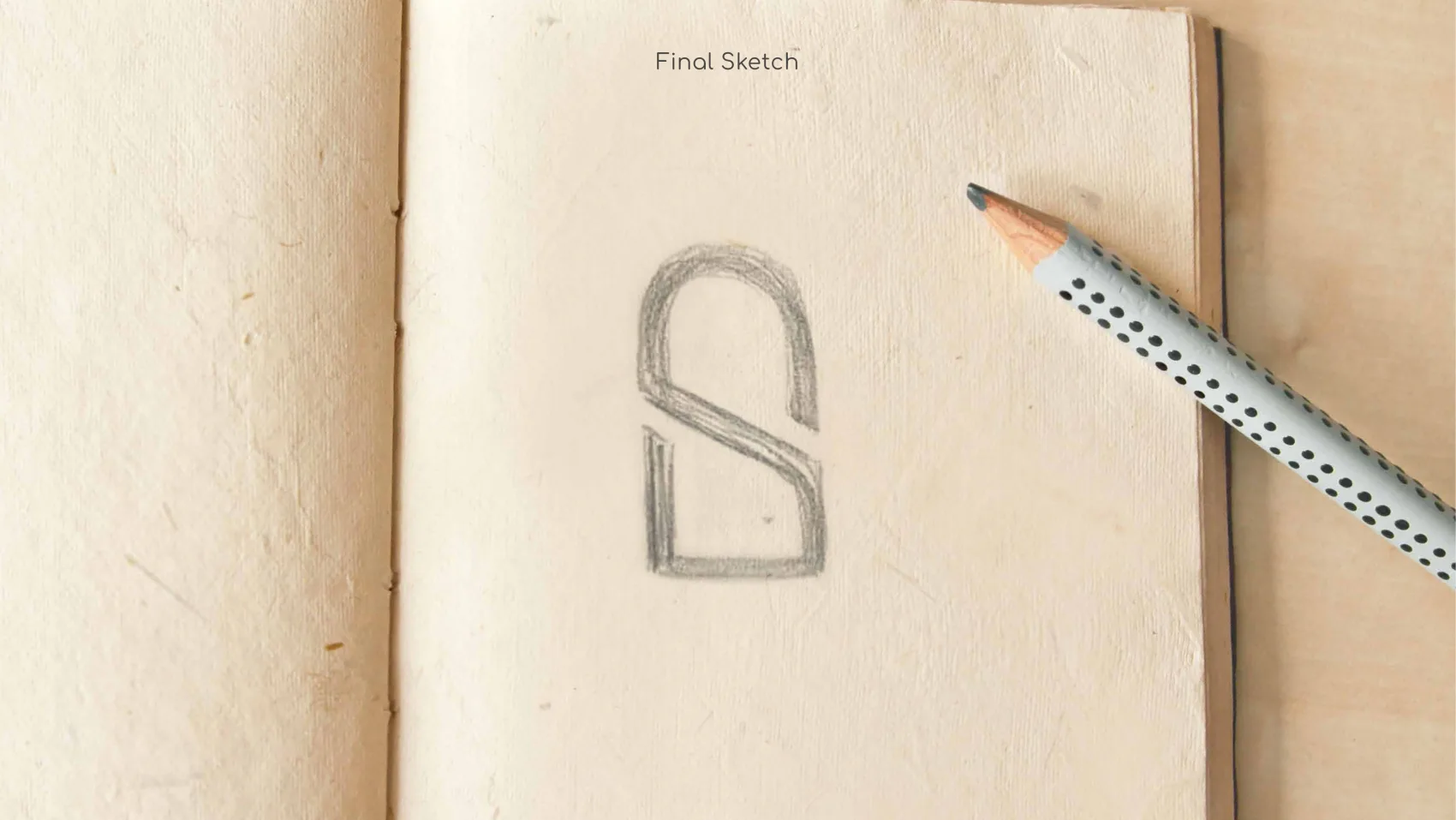 The final pencil sketch — an arch with a diagonal stroke forming an S