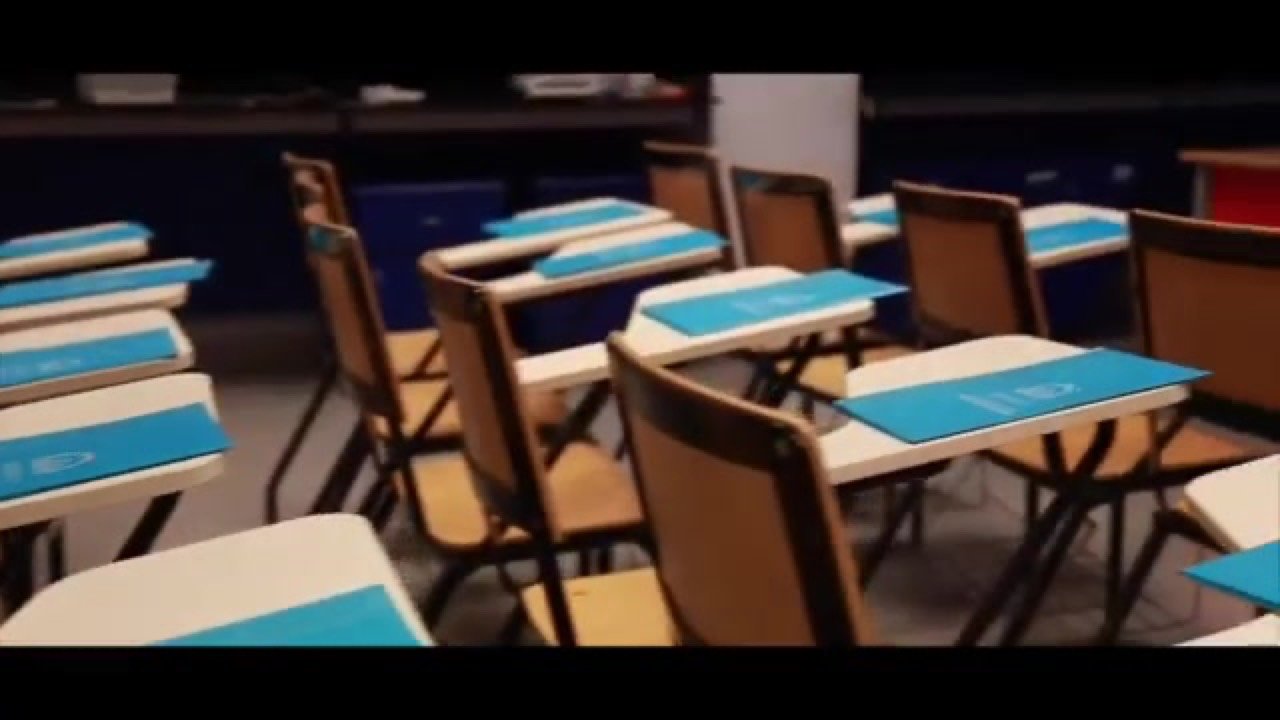 A frame from the documentary — a Zewail City classroom with teal desks