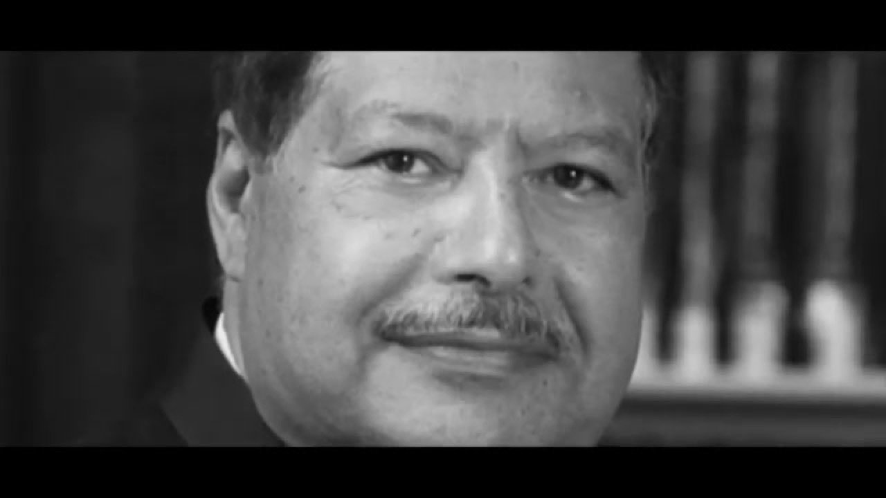Dr. Ahmed Zewail, founder of Zewail City, in a black-and-white portrait from the documentary